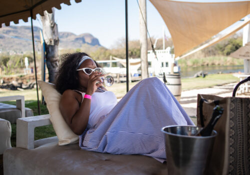 Lady sipping wine at zanzibar